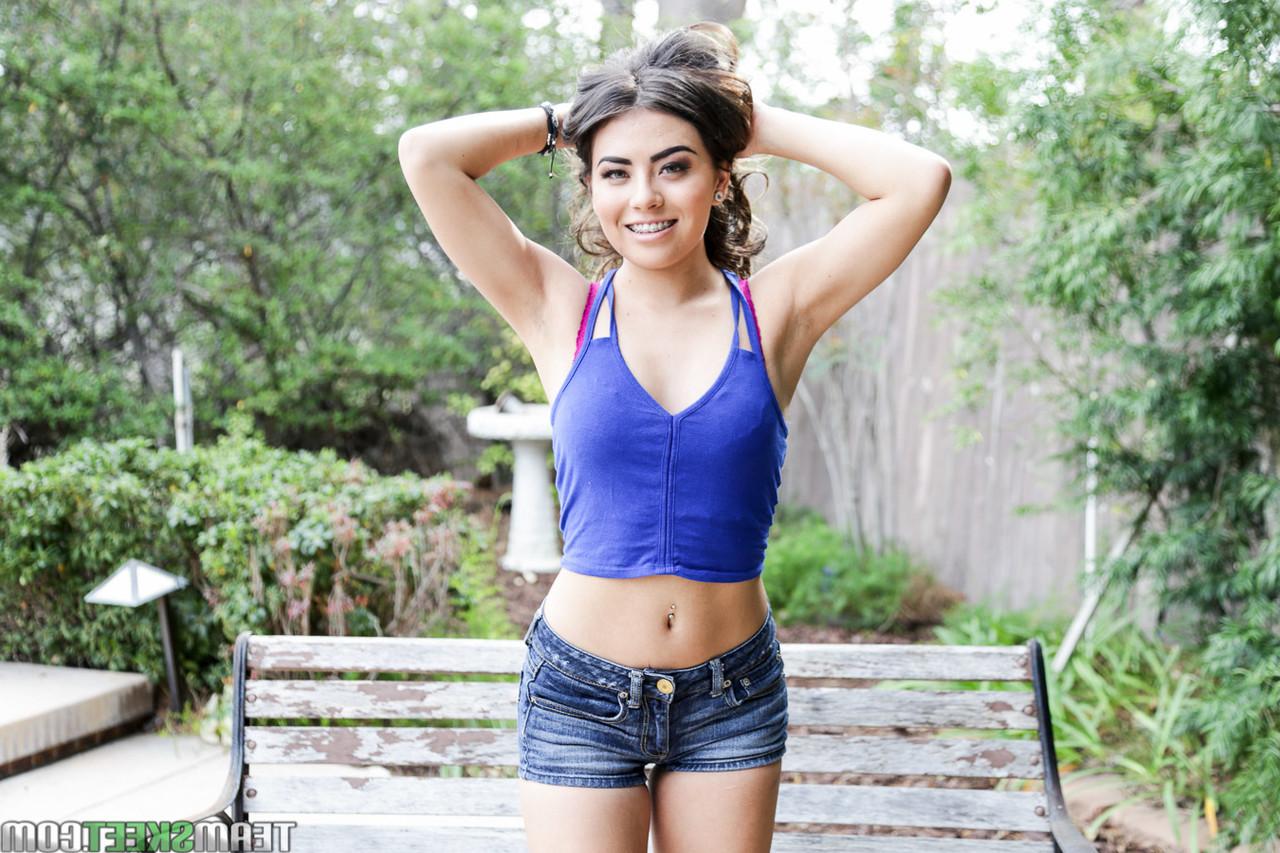 17P Cute brunette chick Amina Allure gets naked outdoors near the pool