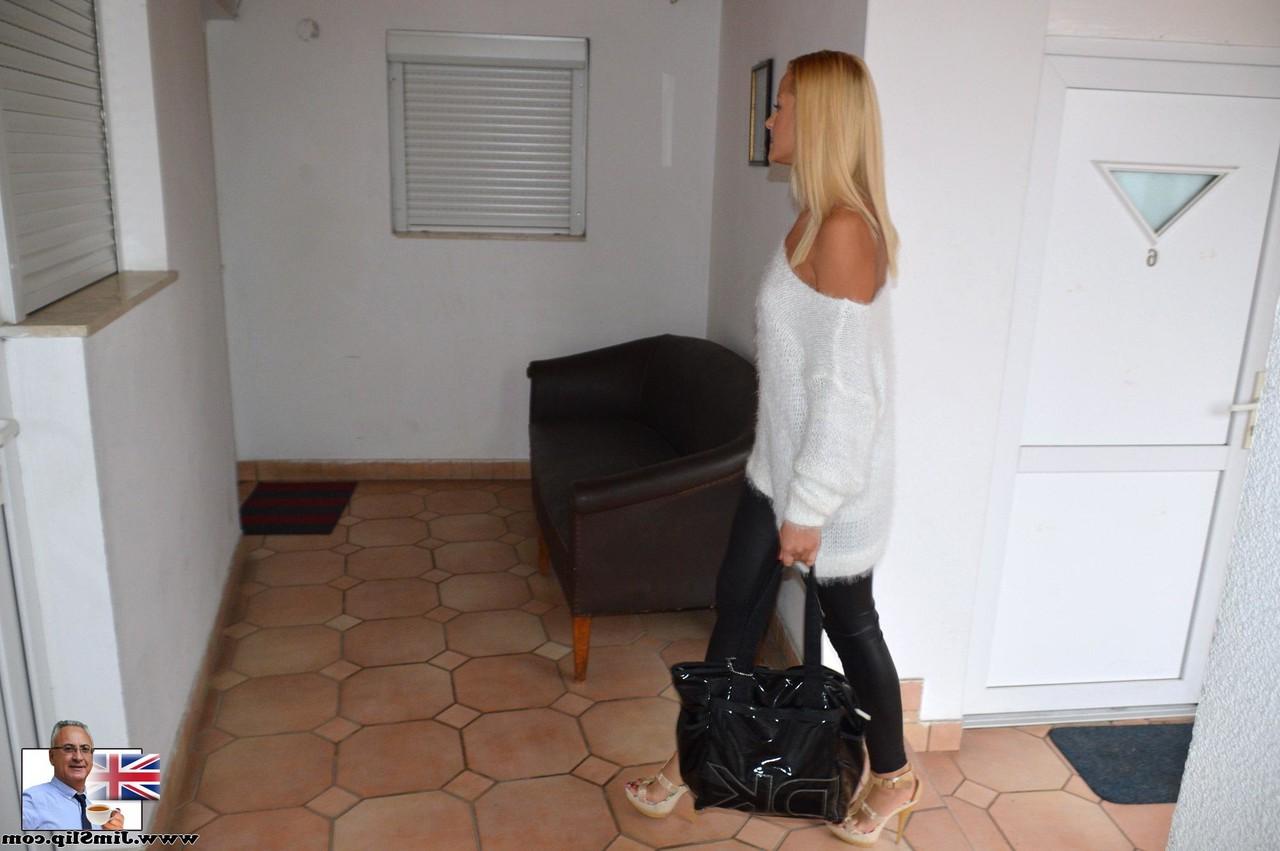 17P Tanned blonde Cherry Kiss takes off white pullover and tight black pants