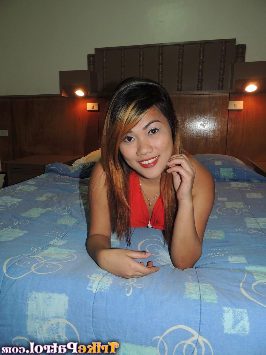 15P Asian first timer Shakira licks a boob before getting naked on a bed