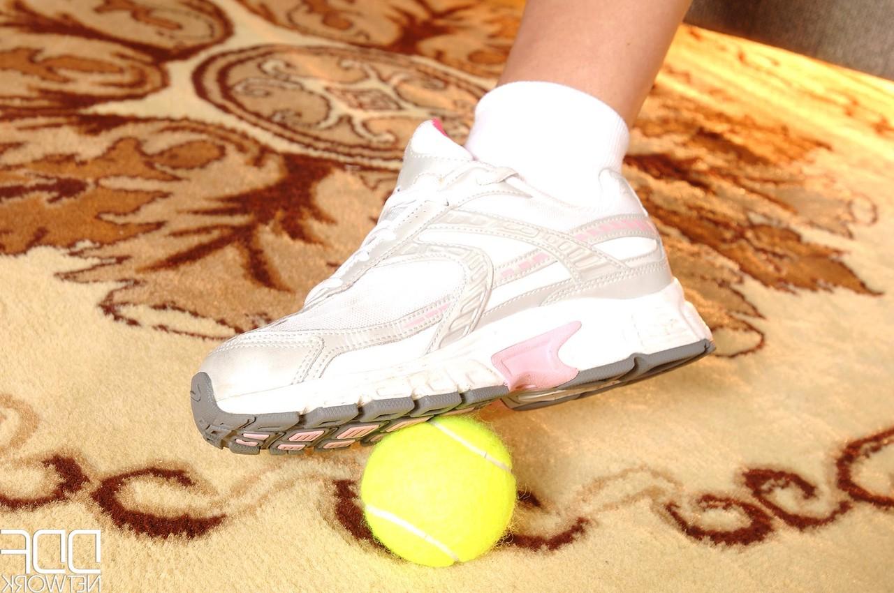 20P Tennis player Angel Kiss strips before using her hot feet to play with a ball