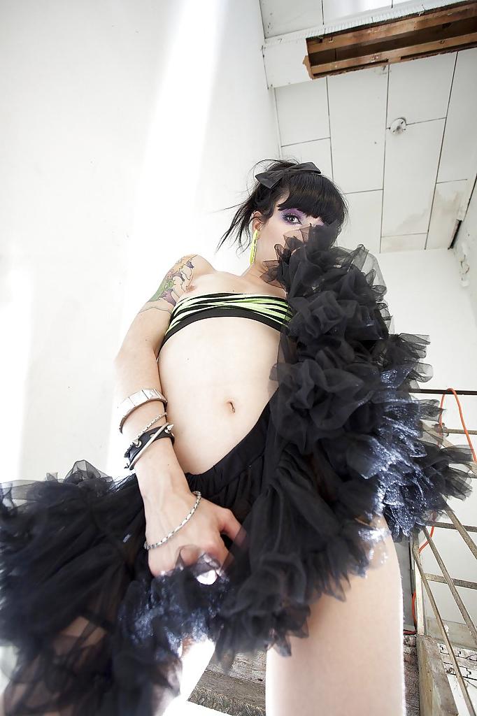16P Kinky raven-haired babe revealing and fingering her bald pussy