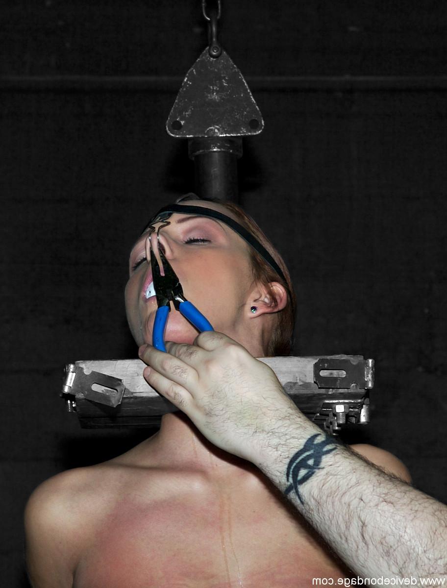 17P Unfortunate female is held in place by neck and nose restraints