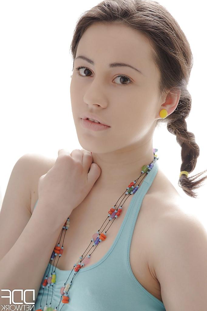 12P Sexy little Euro teen girl in pigtails gingerly removing her panties