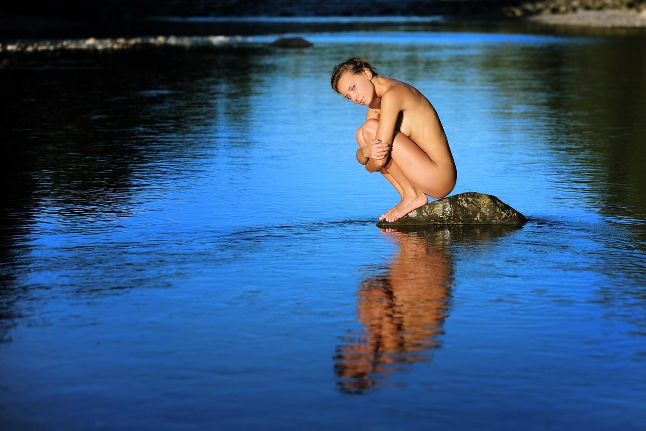 10P Adorable brunette Katya Clover poses naked on the stone in the water