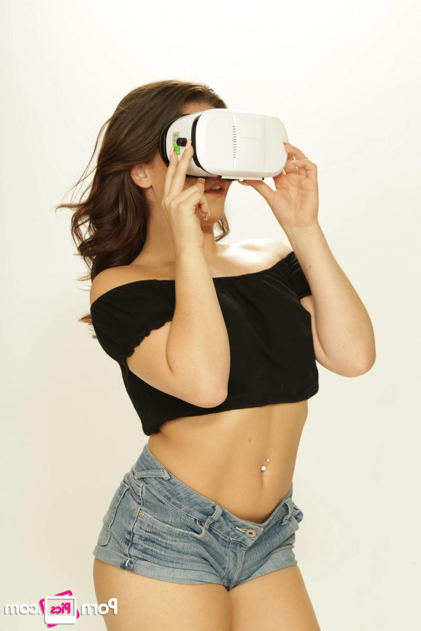 20P Brunette pornstar Kimber Woods teases with her titties while playing a VR game