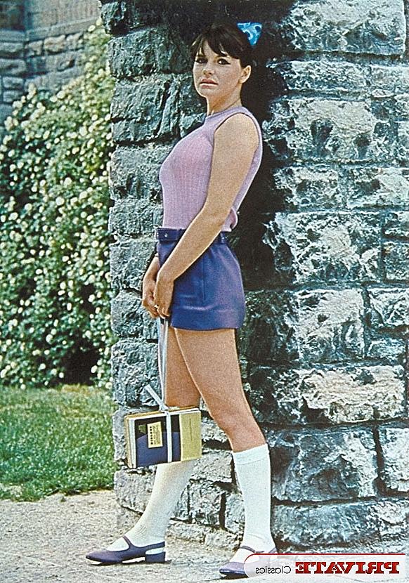 11P A schoolgirl from the 70s era poses for a variety of naughty solo shoots