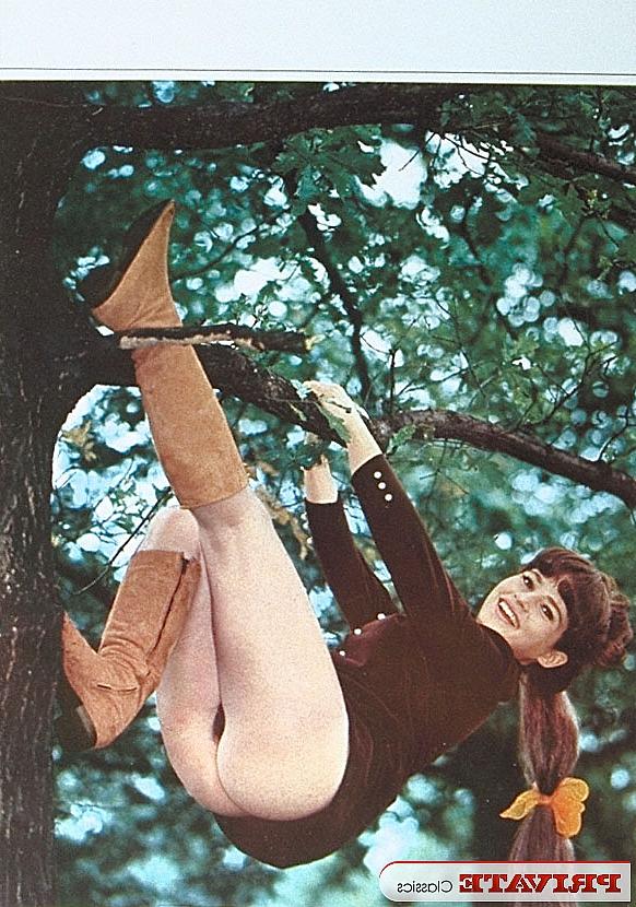 11P A schoolgirl from the 70s era poses for a variety of naughty solo shoots