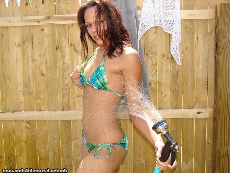 12P Young amateur wets herself with a garden hose while wearing a bikini