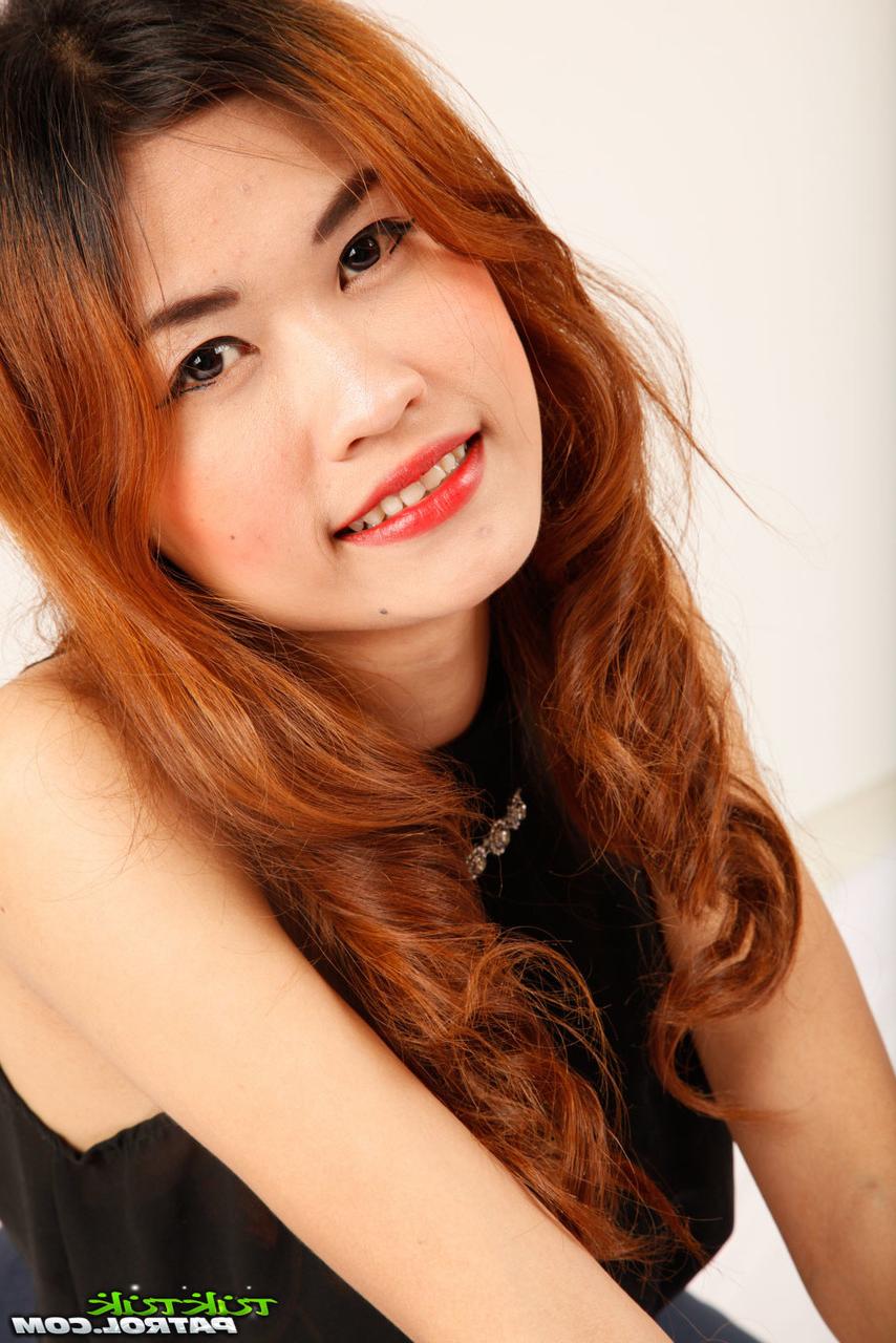 20P Slutty Asian brunette with skinny body posing in solo action and showing pussy