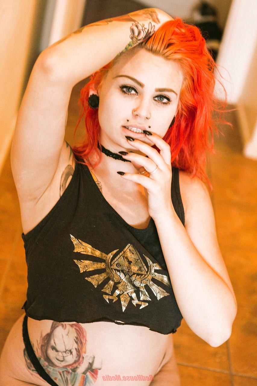20P Redheaded inked babe Zelda teases with her fat ass in a hot thong