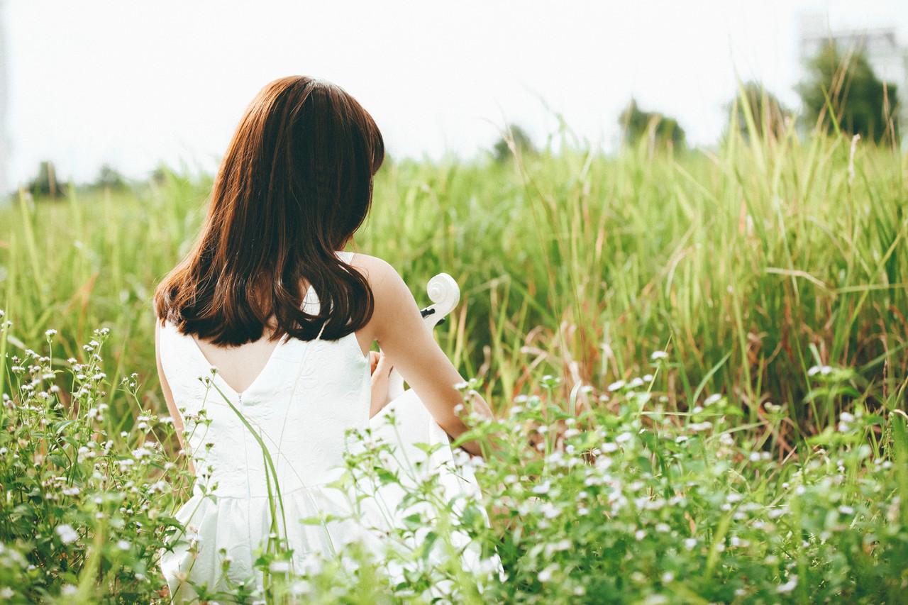 20P Cute Asian musician poses in her white dress while playing a violin outside
