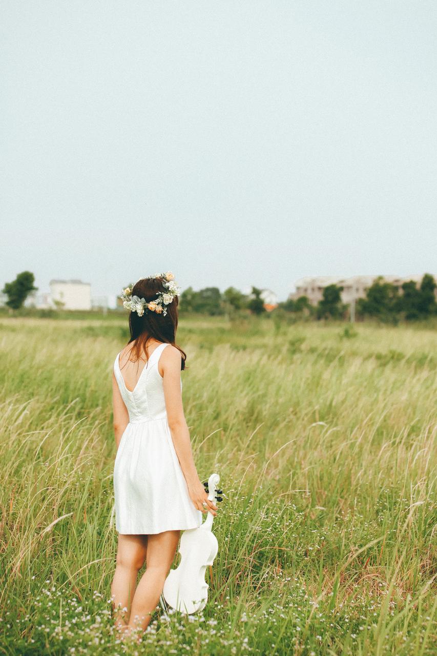 20P Cute Asian musician poses in her white dress while playing a violin outside
