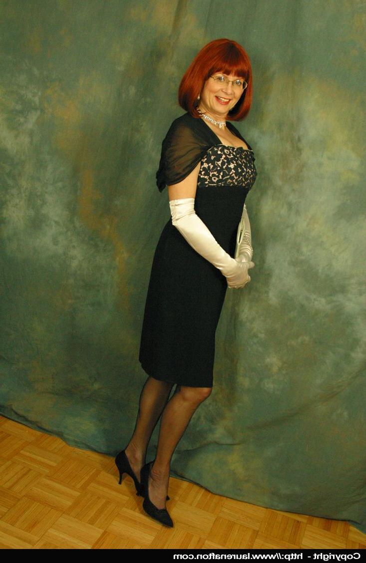 12P Older redhead Abigail Fraser exposes her boobs in a girdle and long gloves