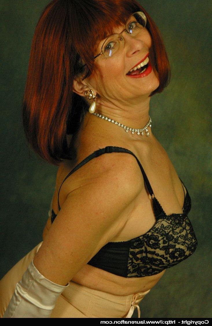 12P Older redhead Abigail Fraser exposes her boobs in a girdle and long gloves