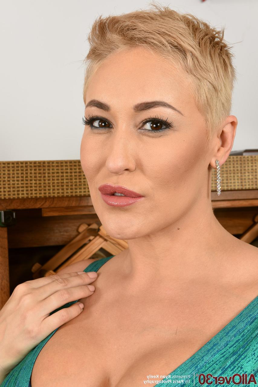 20P Short-haired babe Ryan Keely loses her elegant dress & shows her big tits