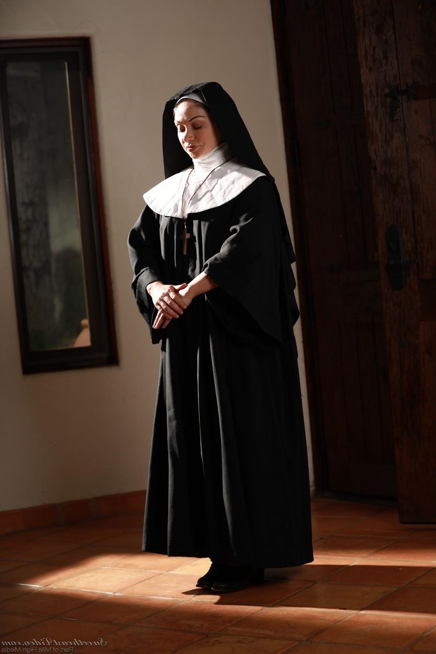 20P Naughty nun in white stockings Lea Lexis strips and masturbates on the floor