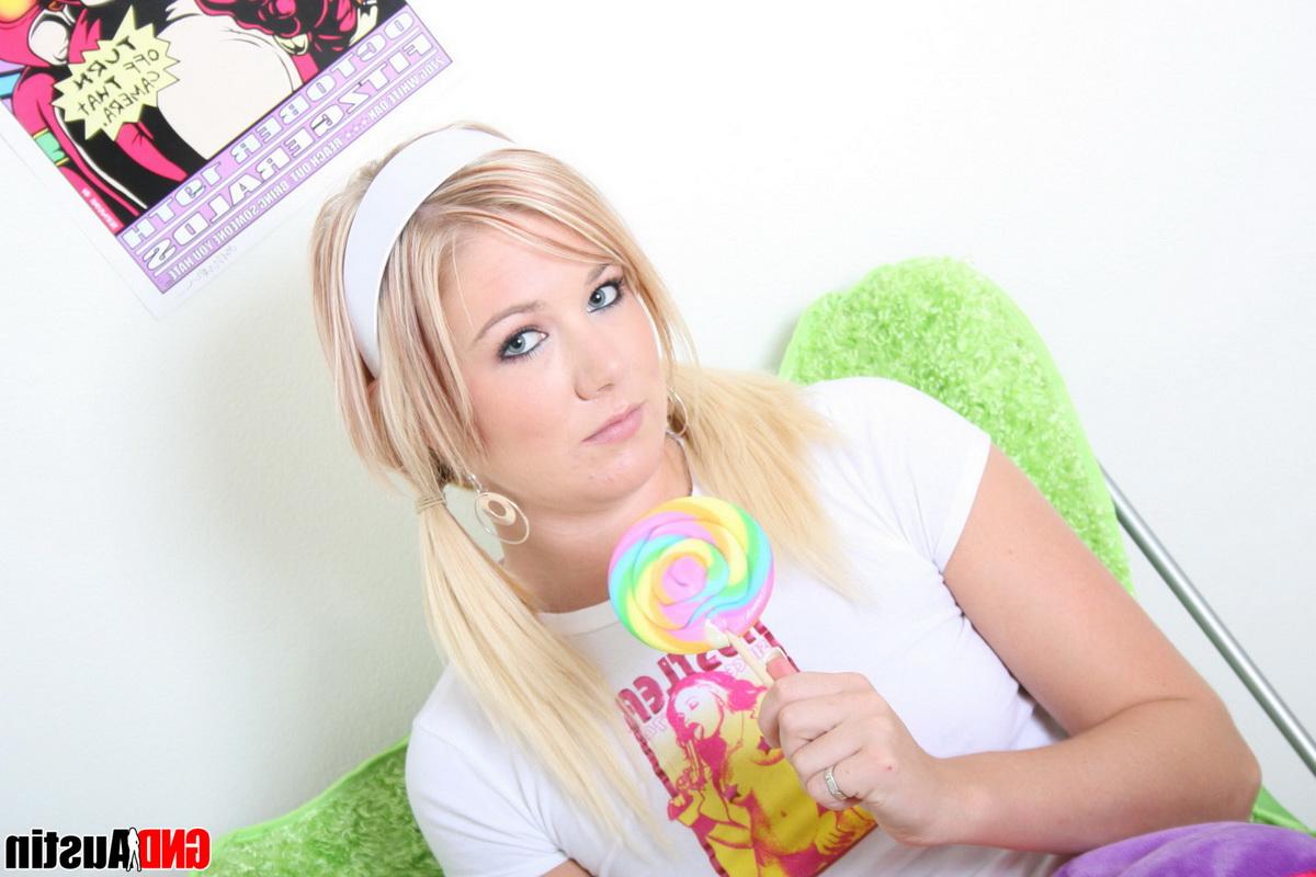 12P Cute blonde licks a sucker while exposing her tits and pussy in pink socks