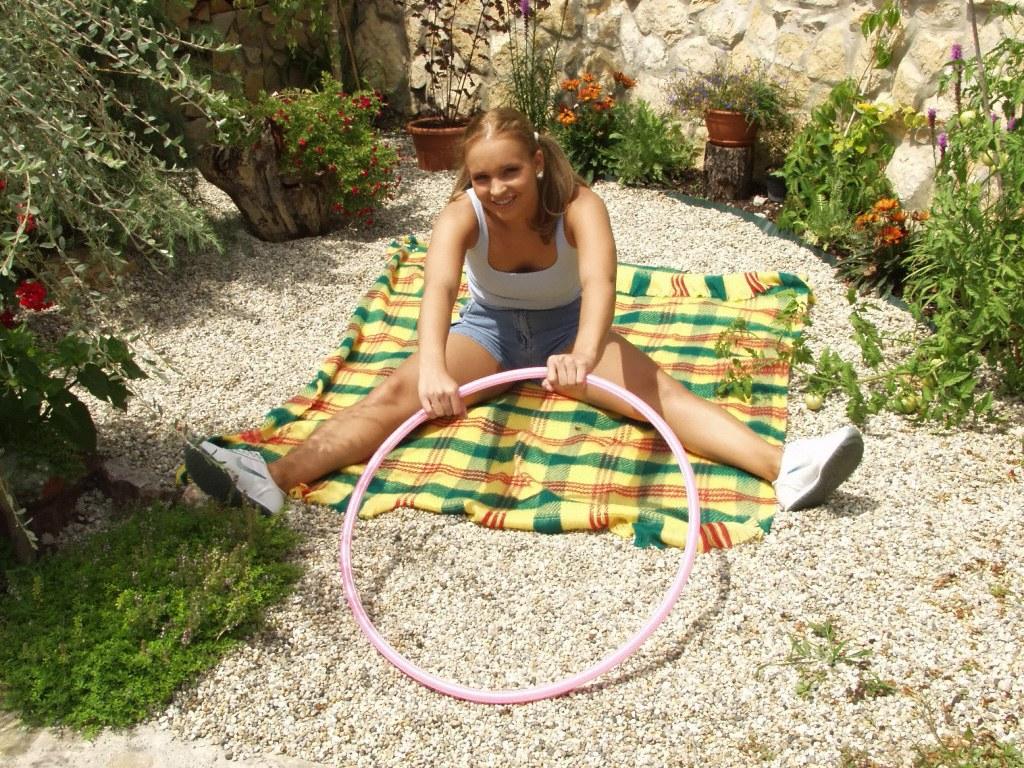 18P Amateur girl Sweet Tiffany gets naked in pigtails upon a blanket in the garden