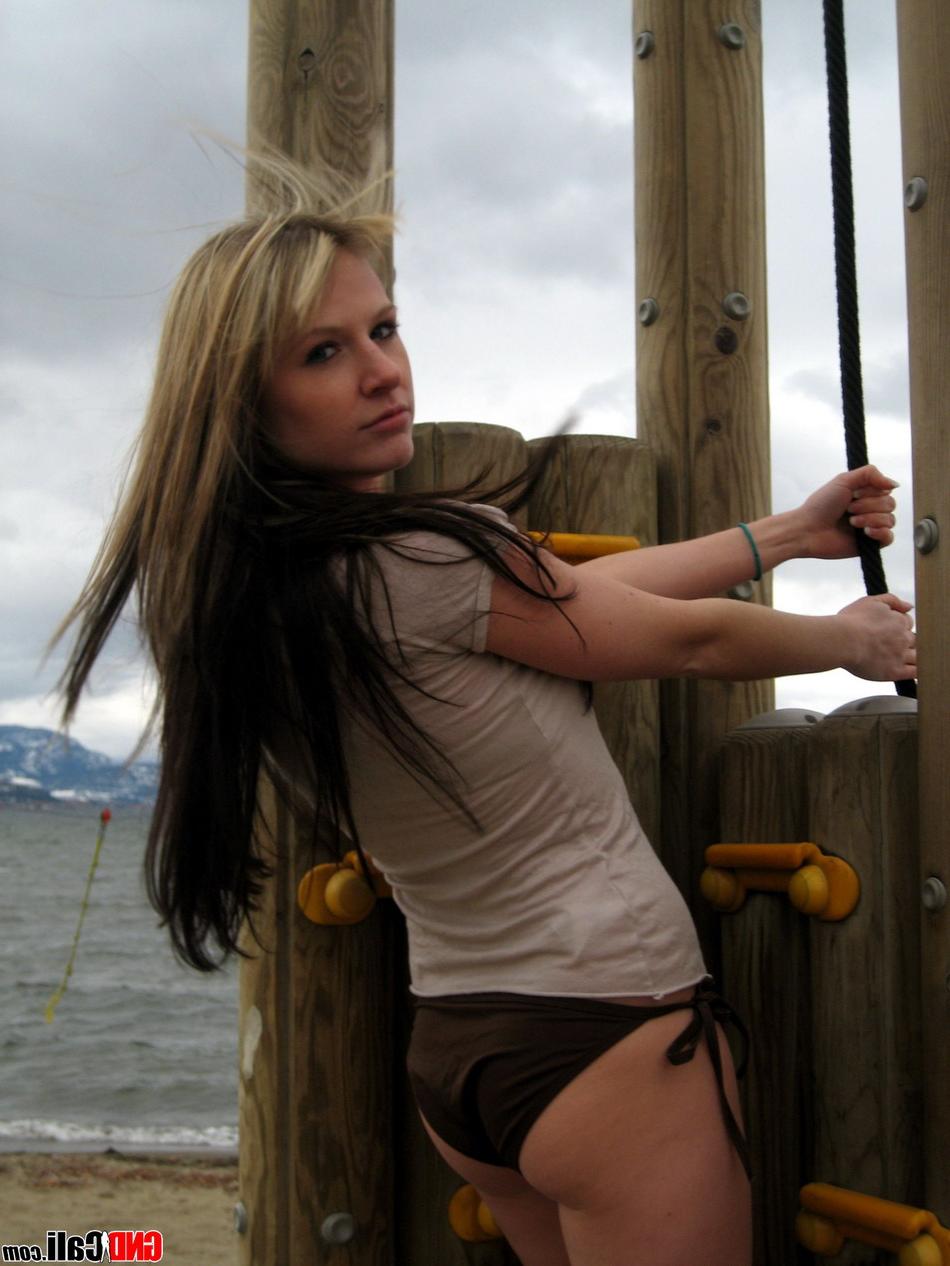 12P Amateur girl models in a T-shirt and bikini bottoms at the beach