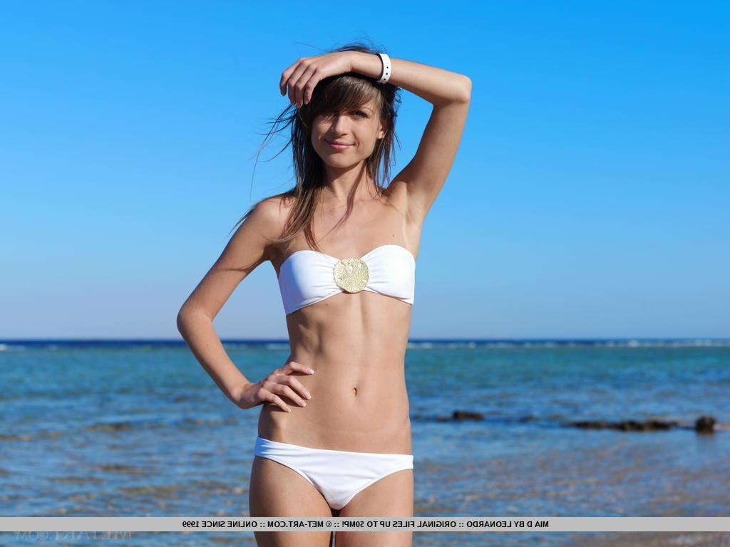 18P Pretty brunette Mia D at the beach doffing bikini to show shaved wet pussy
