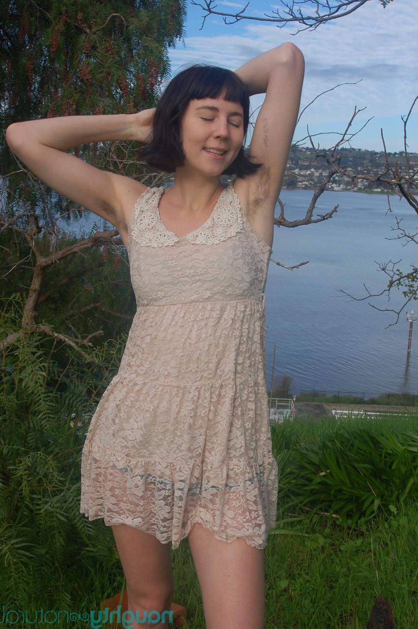 20P Short brunette Coral Aorta undressing and playing with her long pussy hair