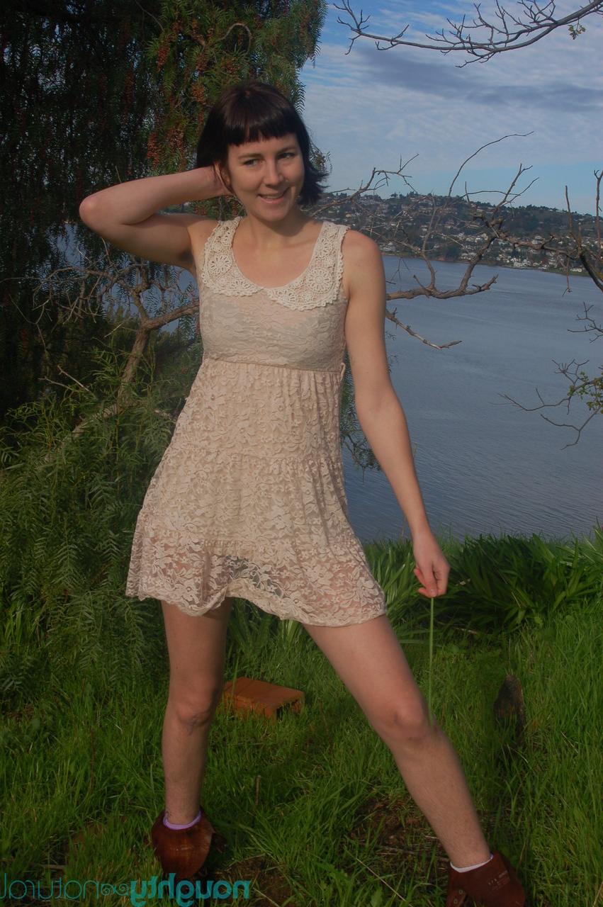 20P Short brunette Coral Aorta undressing and playing with her long pussy hair