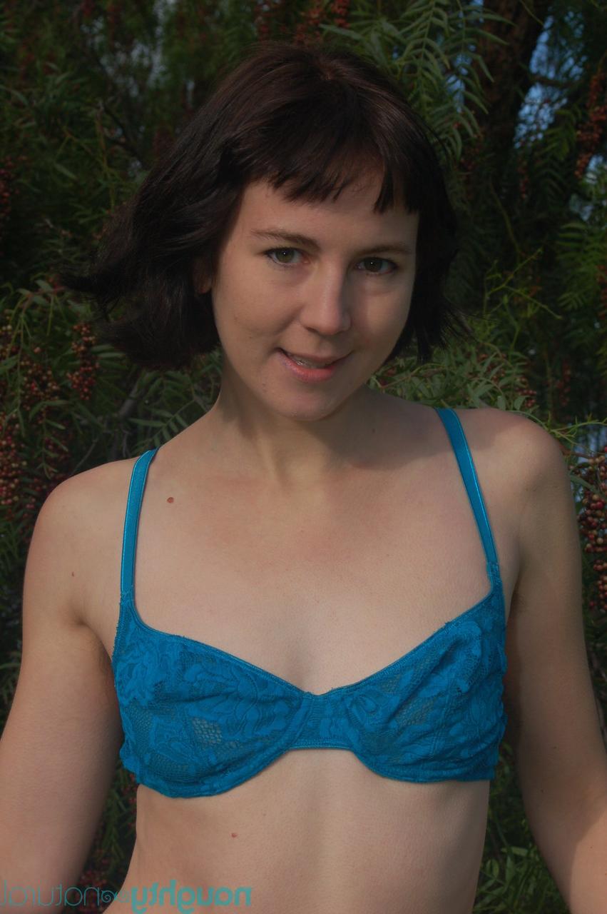 20P Short brunette Coral Aorta undressing and playing with her long pussy hair