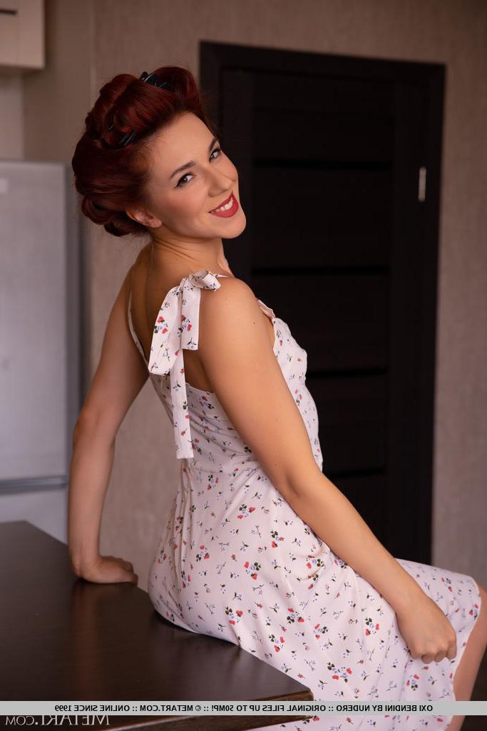 18P Pretty redhead Oxi Bendini wears her hair pinned up while getting bare naked