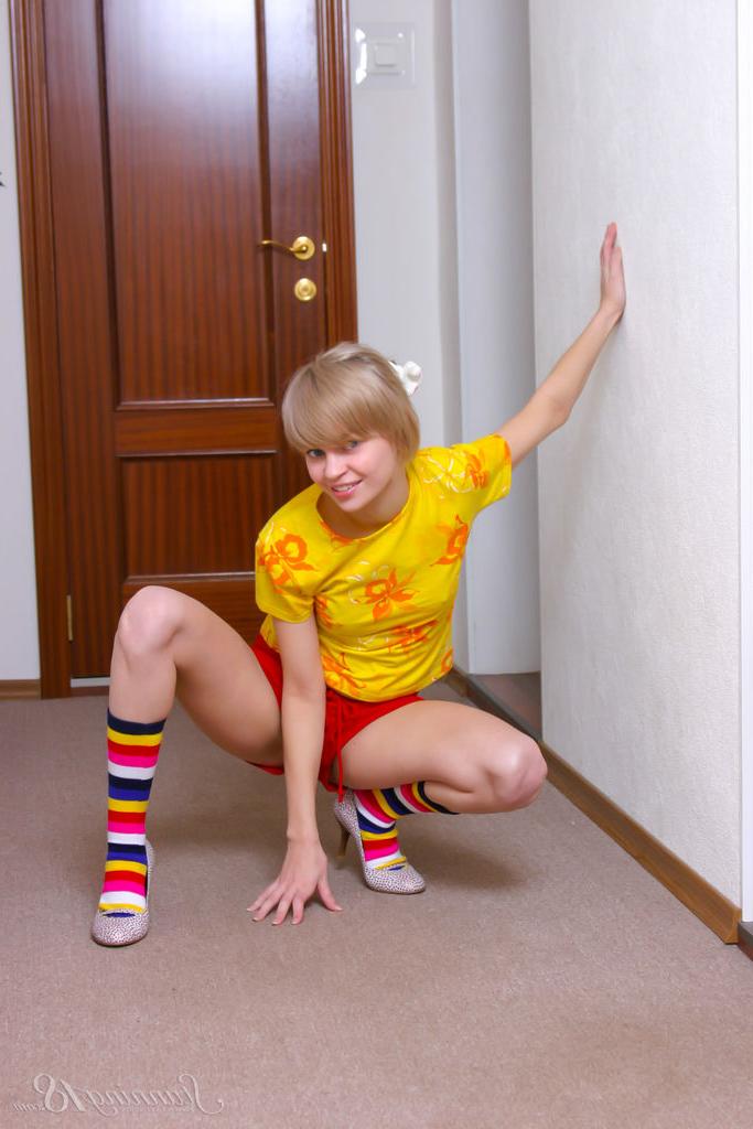 16P Cute 18 year old Lily L sports short blonde hair while getting naked in socks