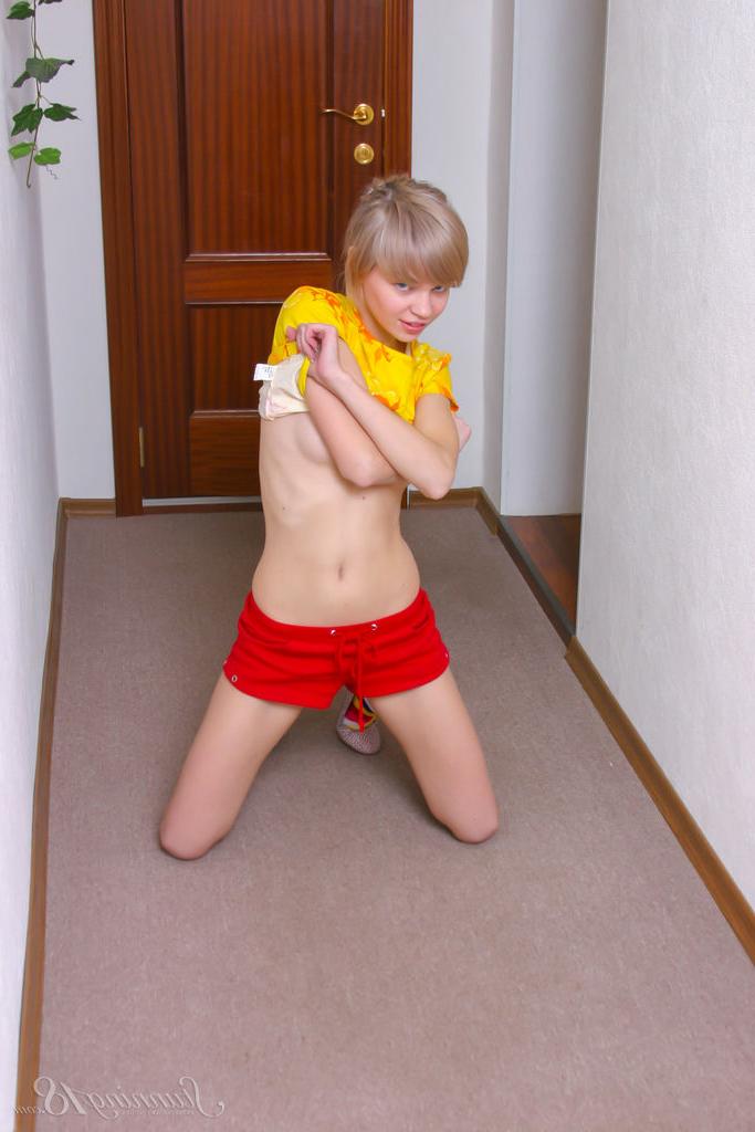 16P Cute 18 year old Lily L sports short blonde hair while getting naked in socks