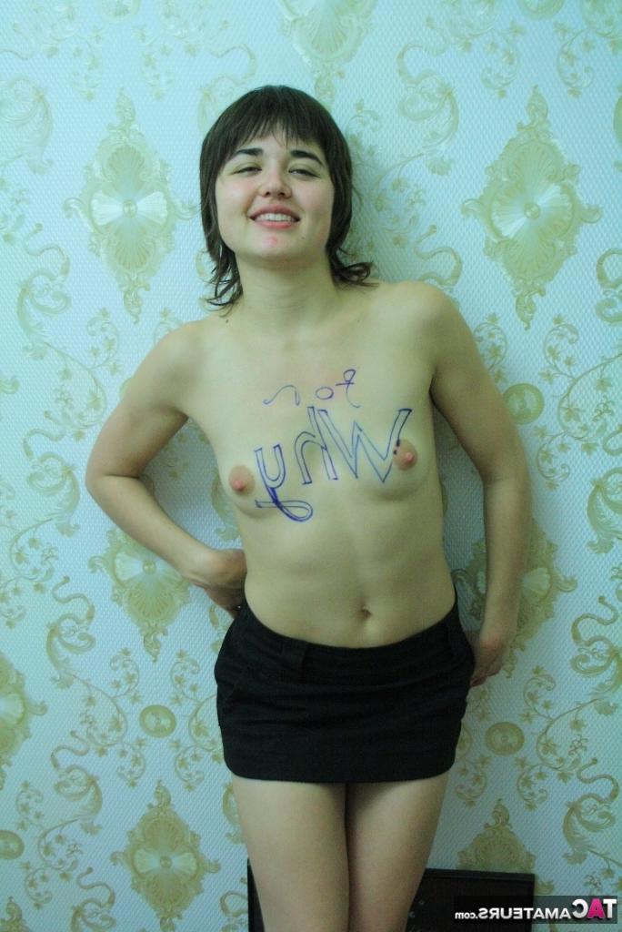 16P Petite brunette Malika shows her almost flat chest in a black miniskirt