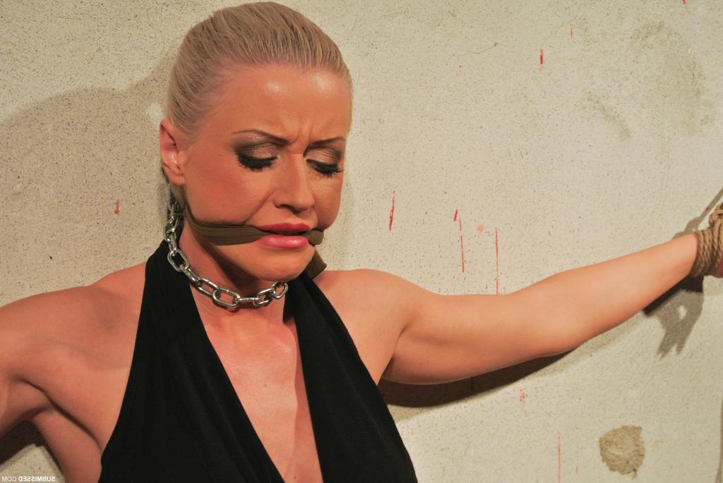 16P Submissive female is gagged and chained to a wall before force masturbation