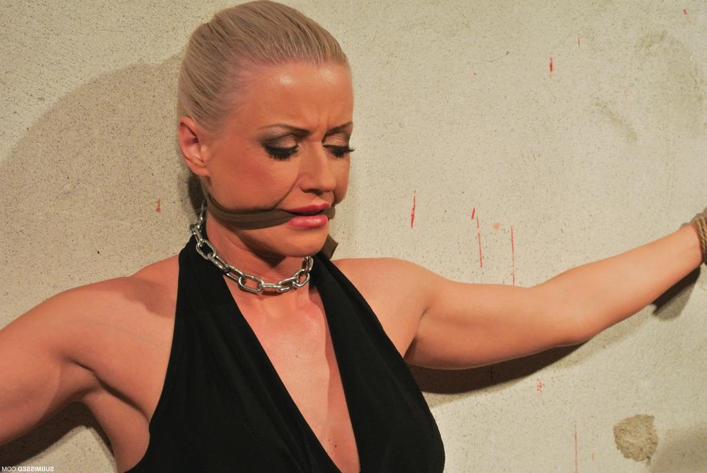 16P Submissive female is gagged and chained to a wall before force masturbation