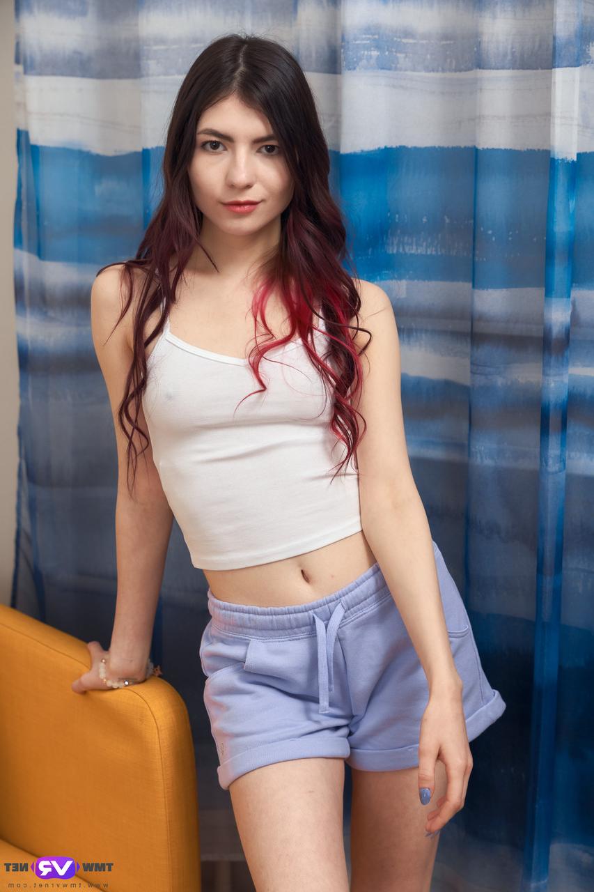 20P Pretty brunette teen Luna Lynx plays with her shaved pussy on her bed