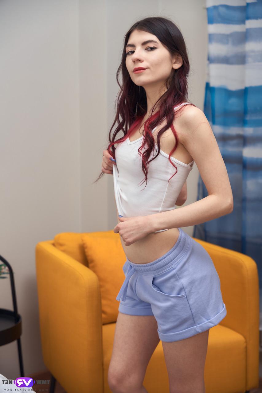 20P Pretty brunette teen Luna Lynx plays with her shaved pussy on her bed