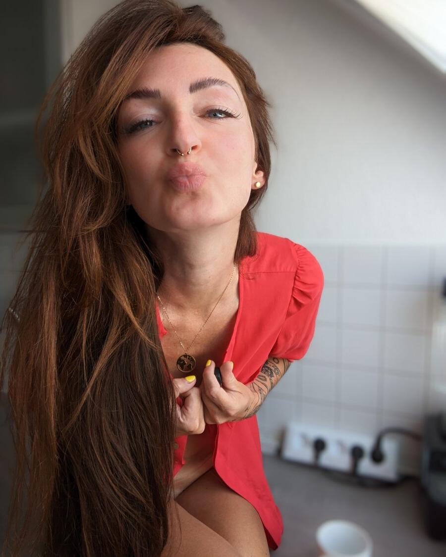 18P Pretty redhead Lara Lauren doffs her shirt and teases in sexy red panties