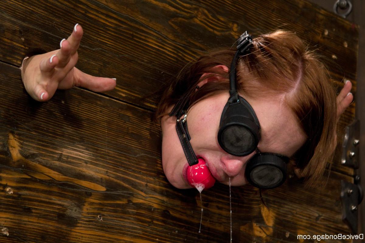 17P Gagged slave Charlie Ann cuffed in the pillory for naked BDSM ass whipping