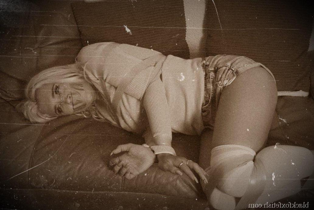 16P Blonde chick is restrained with yellow tape in a sweater and OTK socks