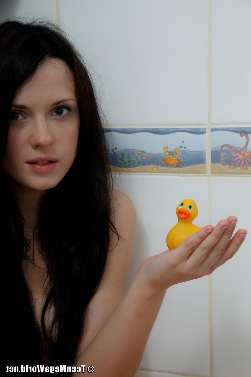 15P Dark haired teen Silver holds a rubber duckie while naked in the shower