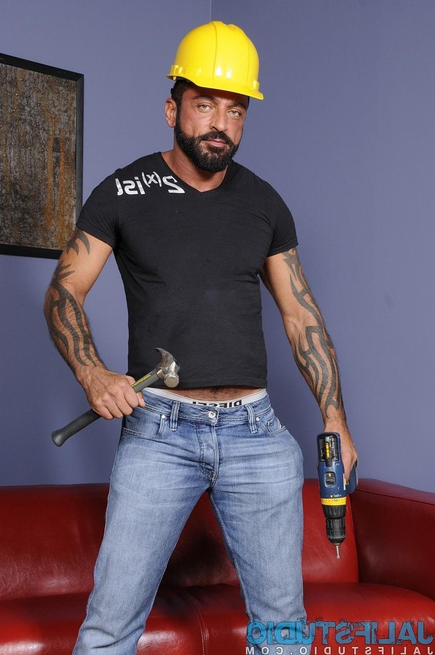14P Gay construction worker Tom Colt strips & shows his hairy inked body & cock