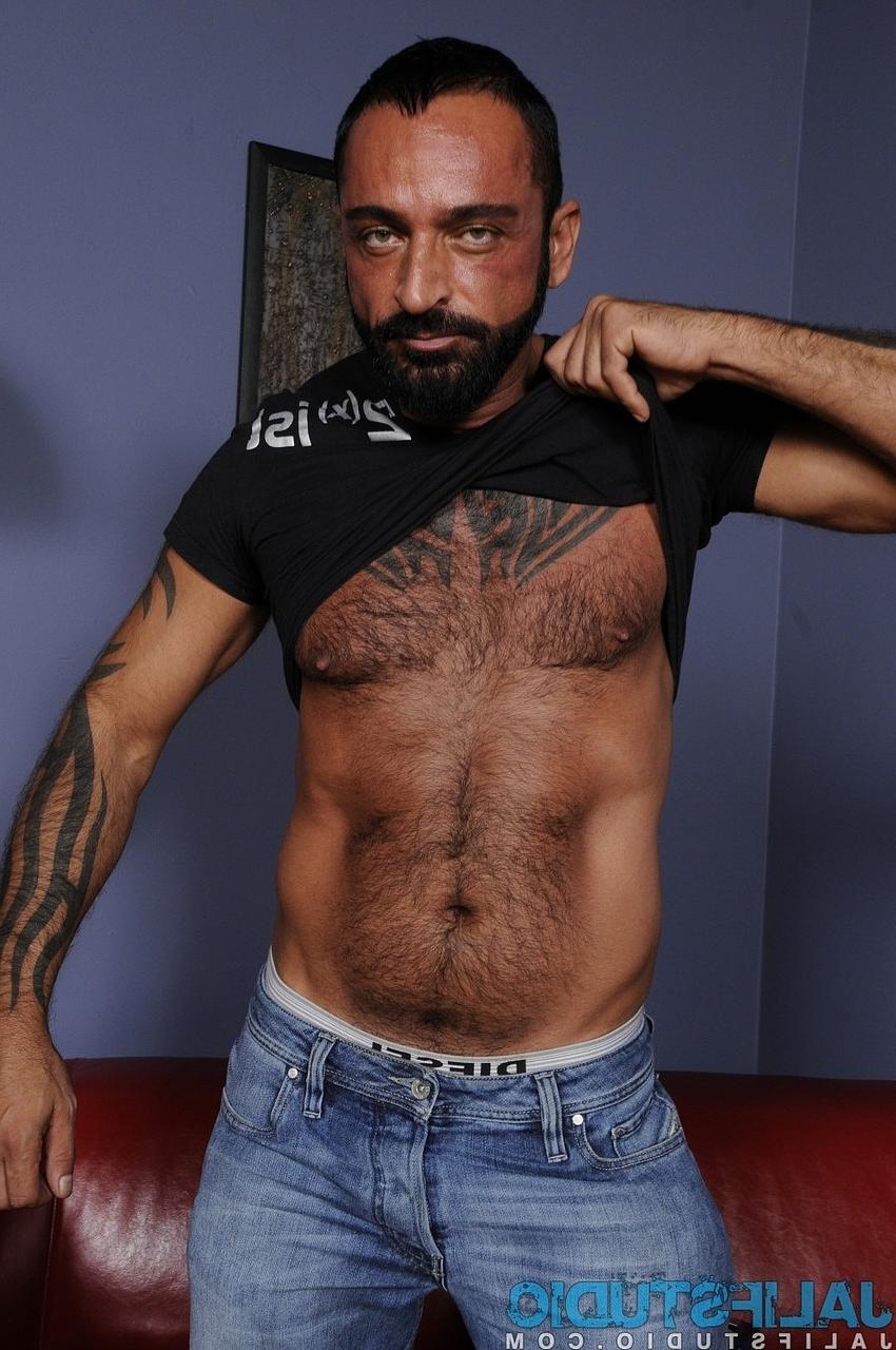 14P Gay construction worker Tom Colt strips & shows his hairy inked body & cock