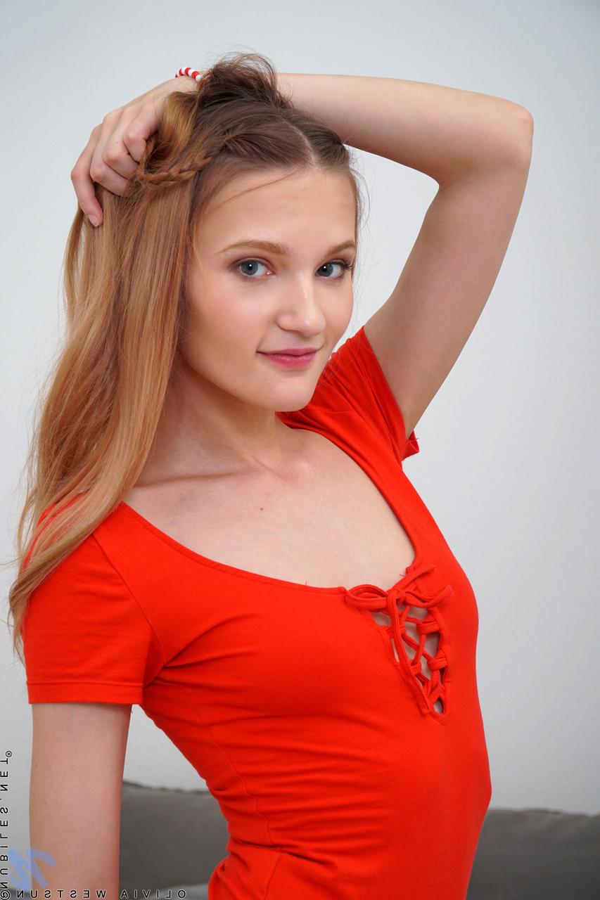 20P Pretty babe Olivia Westsun plays with her sweet shaved pussy on her bed