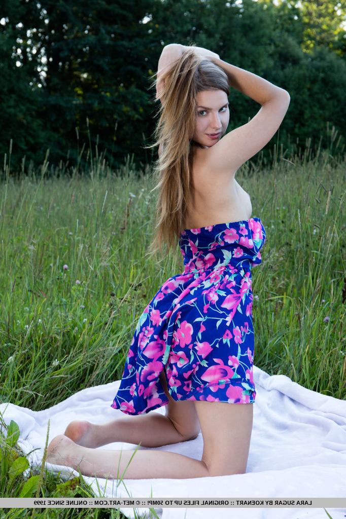 18P Sweet young girl Lara Sugar takes off a summer dress to go nude in a field