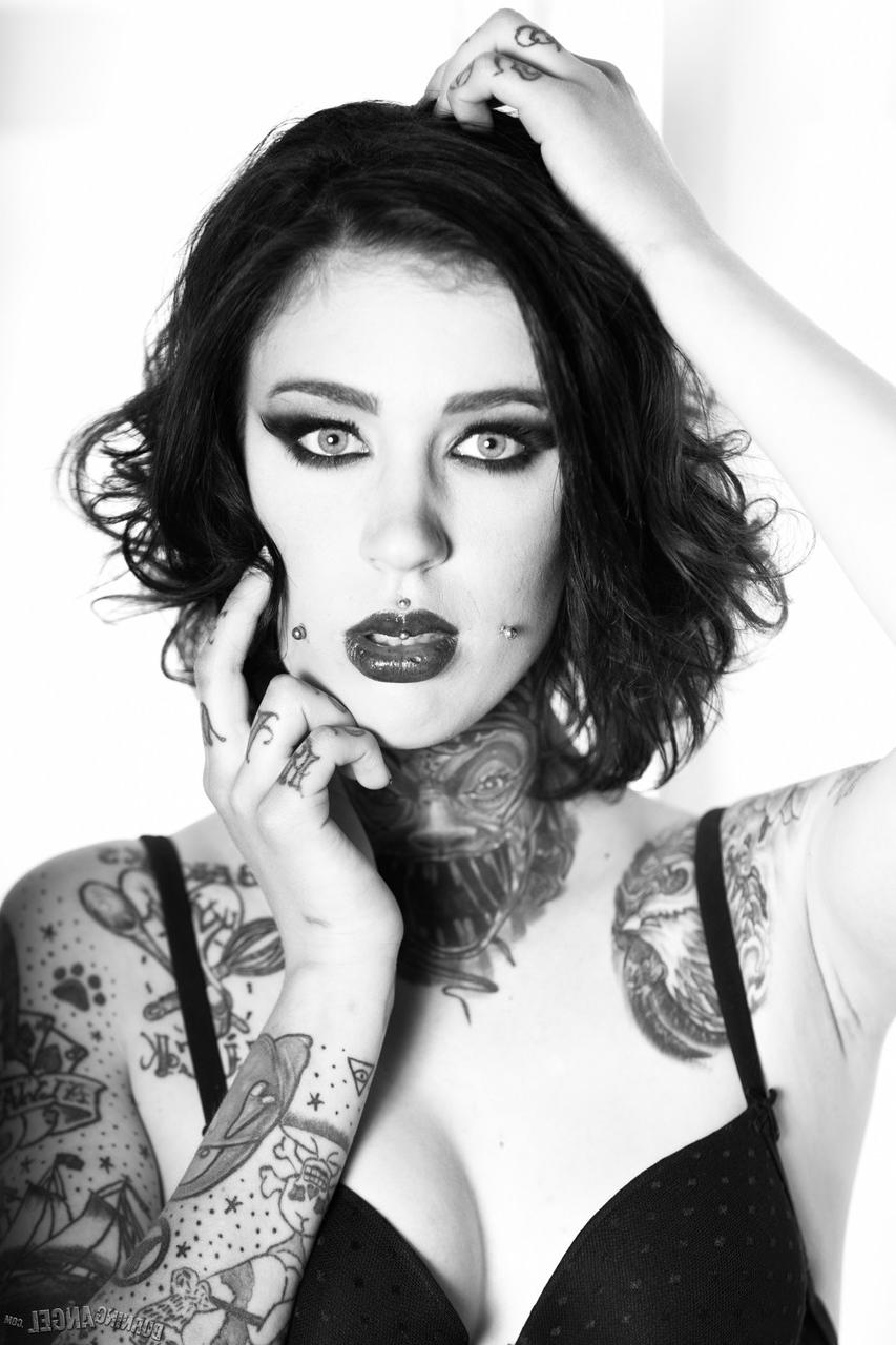 17P Brunette whore shows off her naked tattooed body in a hot black and white solo