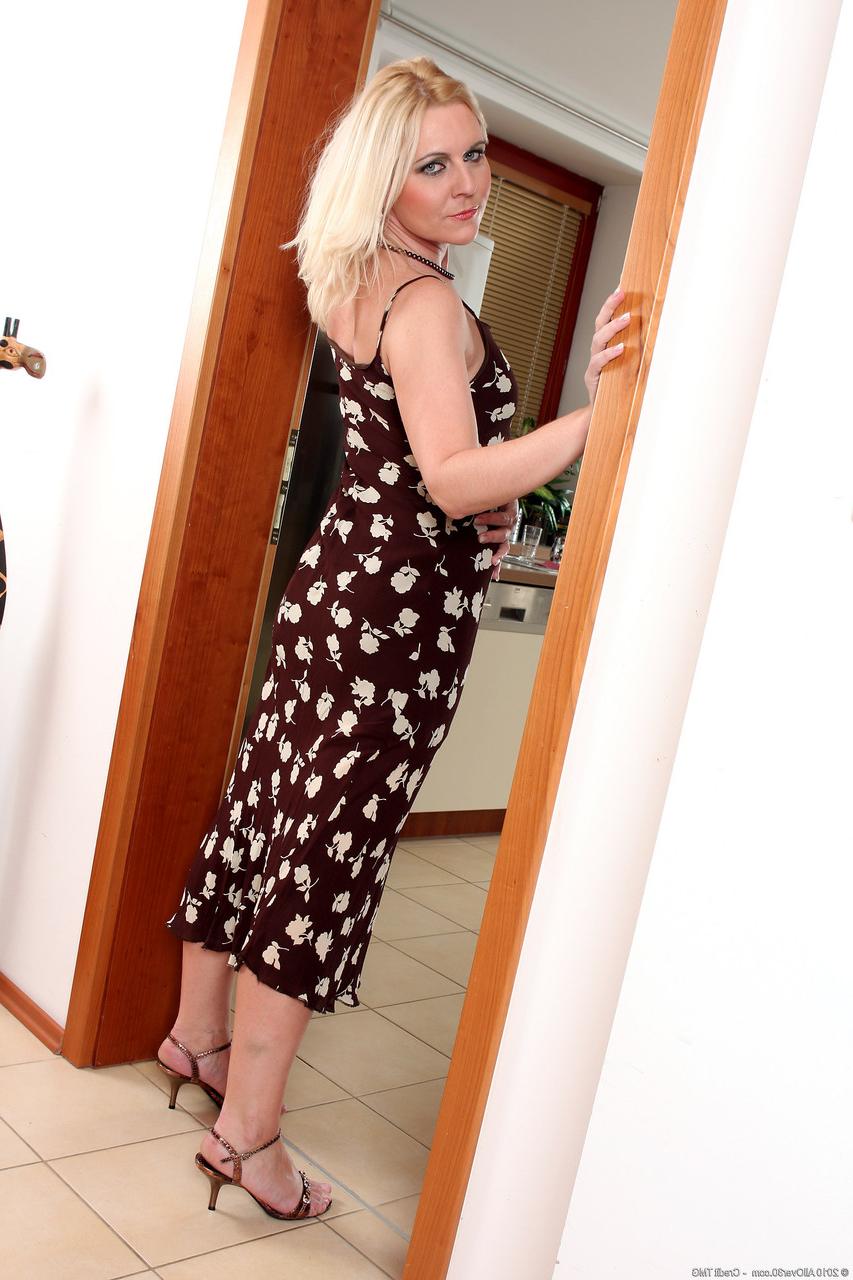 20P Blonde babe Shawnee shows off her small tits during a sexy striptease