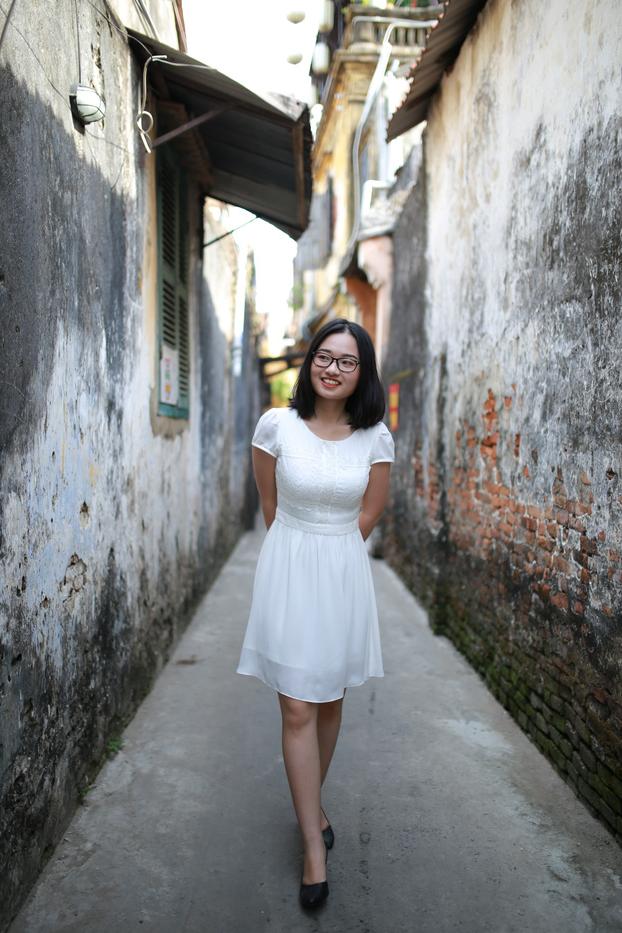 20P Cute Asian girl with eyeglasses posing in her lovely white dress in public