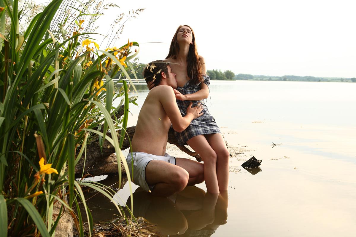 20P Young couple wade into a body of water before getting naked to fuck