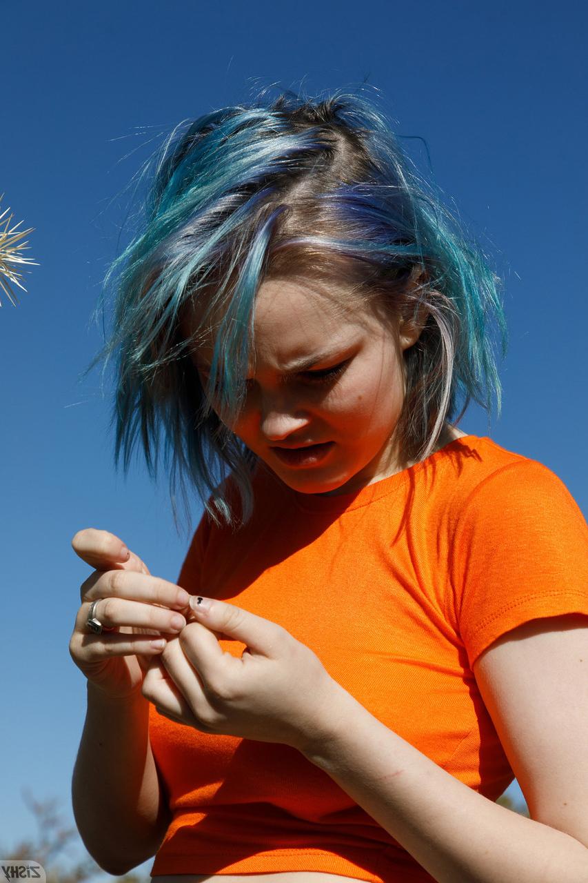 12P Sweet teen Vonnie Bean teases with her underboobs and big ass outdoors