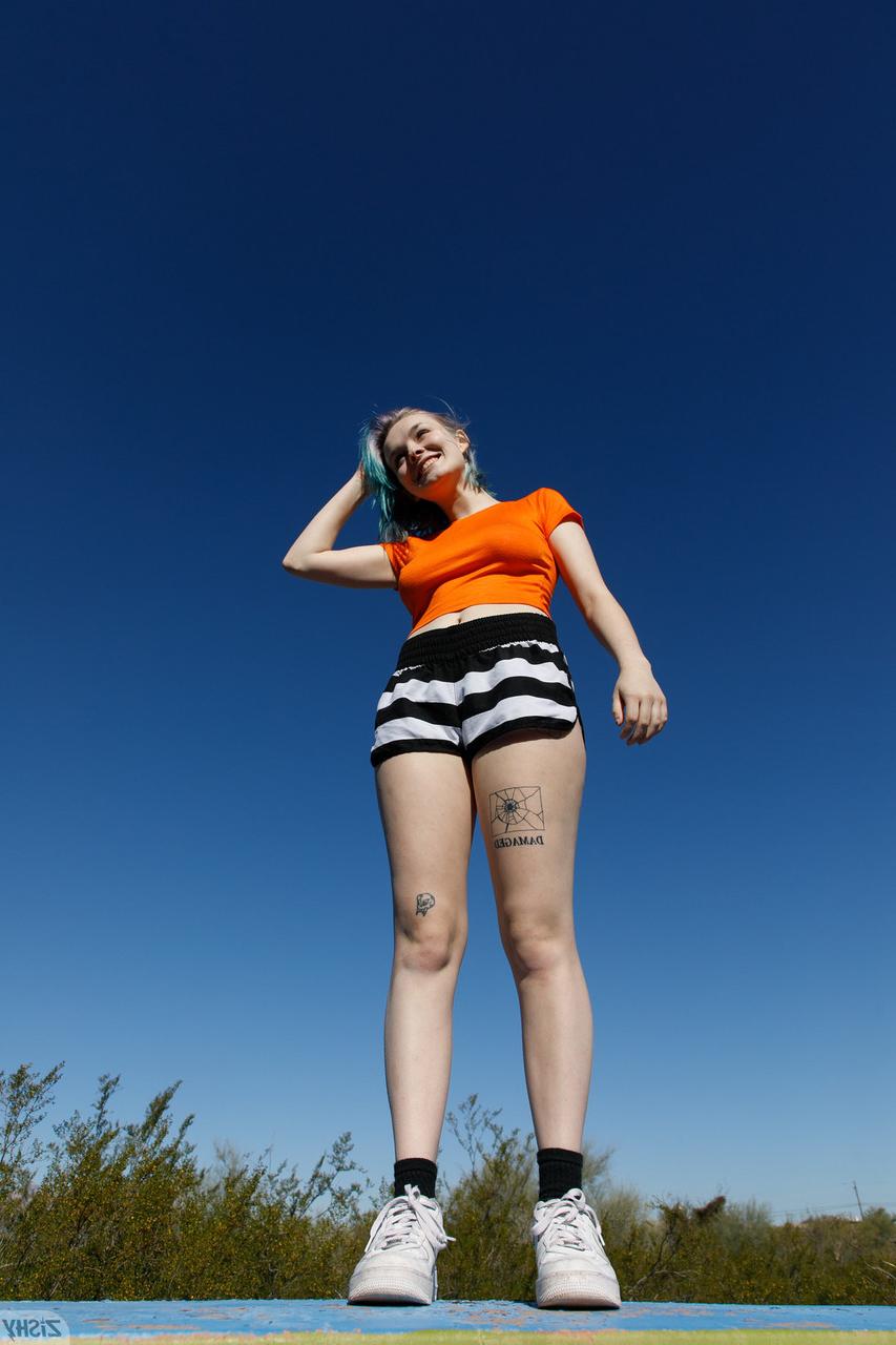 12P Sweet teen Vonnie Bean teases with her underboobs and big ass outdoors