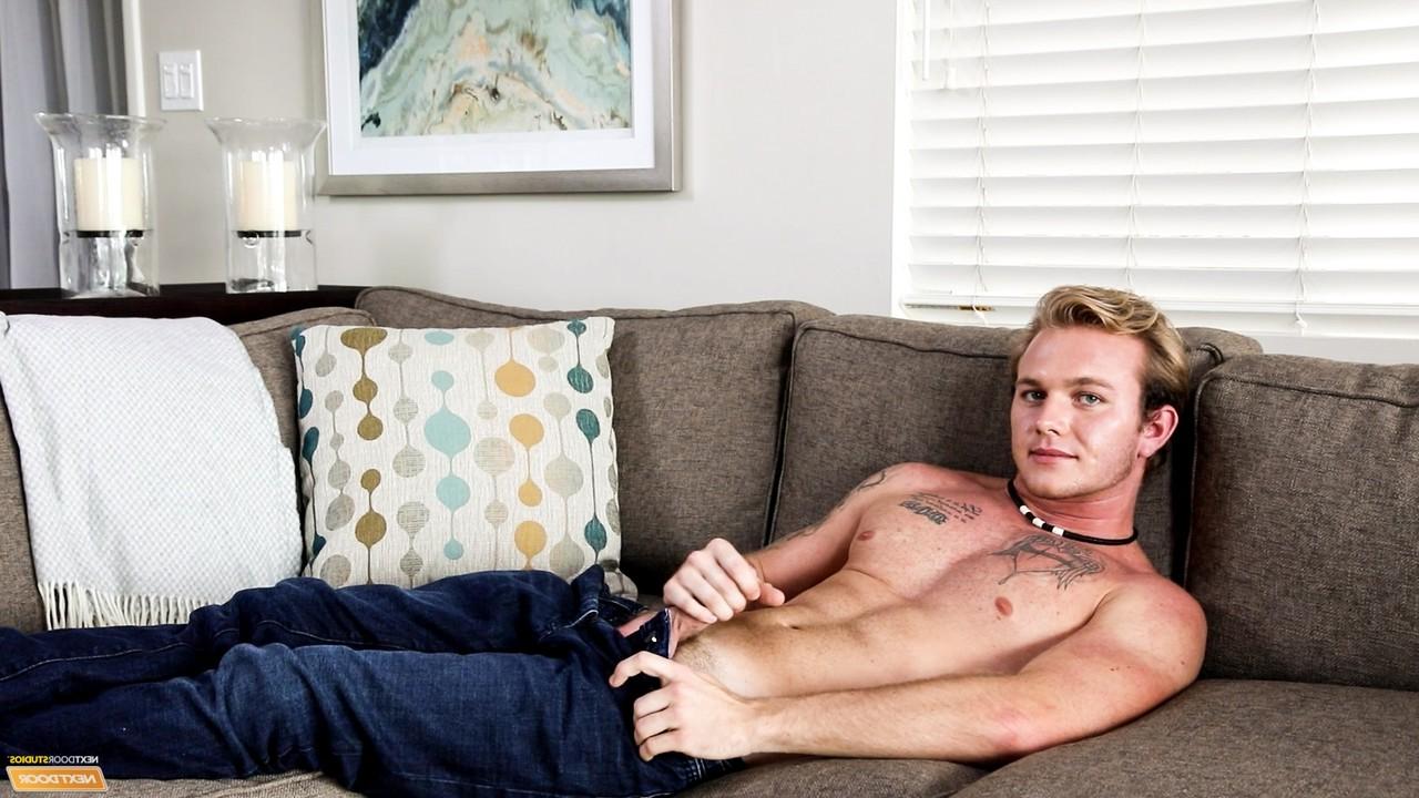 17P Cute tattooed jock Rex Tanner strips on the sofa & strokes his cock to orgasm
